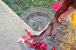 Woman zips up her boots.