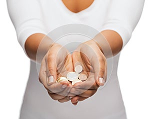 Womans cupped hands showing euro coins