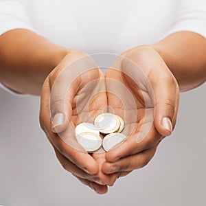 Womans cupped hands showing euro coins