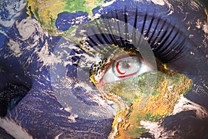 Womans face with planet Earth texture and northern cyprus flag inside the eye.