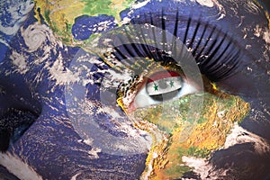 Womans face with planet Earth texture and syrian flag inside the eye