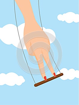 Womans hand balancing on flying trapeze