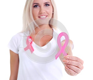 Womans hand holding pink breast cancer awareness ribbon