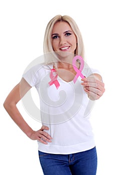 Womans hand holding pink breast cancer awareness ribbon
