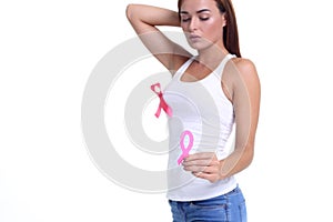 Womans hand holding pink breast cancer awareness ribbon