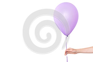 Womans hand holds balloons in a white background