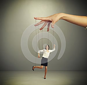 Womans hand manipulating puppet