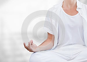 Womans hand Meditating with bright background