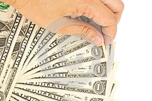 Womans hand picking One Dollar bills.