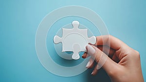 Womans Hand Placing The Last Piece, Completing Jigsaw Puzzle. Concept of Solving Problem