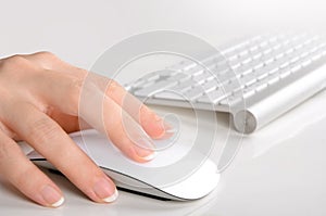 Womans hand typing on computer keyboard