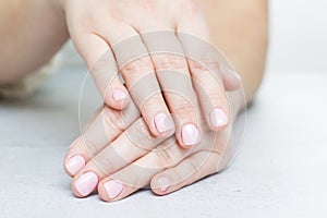 Womans hands with beautiful manicure. Well-groomed female hands
