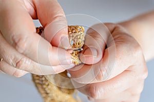 Womans hands with crochet hook and yarn. Handmade hobby concept