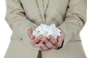 Womans hands cupped with sugar cubes