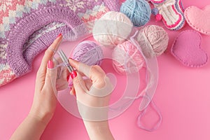 Womans hands with yarn ball and strings