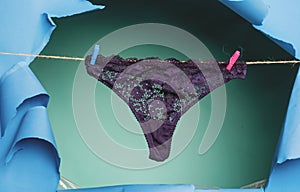 Womans lace panties. Colorful erotic panties. Women's panties on rope. Black panties on clothesline. Woman underwear.