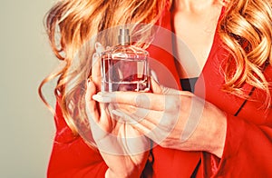 Womans with perfum bottle. Beautiful girl using perfume. Woman with bottle of perfume. Perfume bottle woman spray aroma
