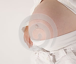 Womans pregnant belly