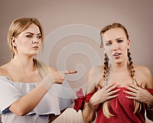 Women accusing each other of something