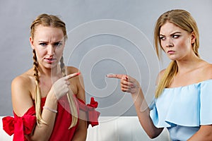 Women accusing each other of something