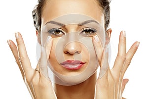 Women applying concealer