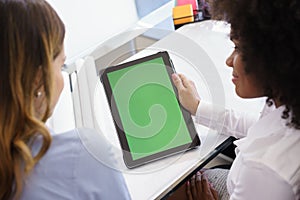 Women Architect Using Tablet PC With Green Screen