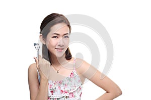 women asian happy smiling with eyelash curler isolated on white background