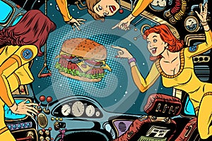 Women astronauts in the cabin of a spaceship and Burger