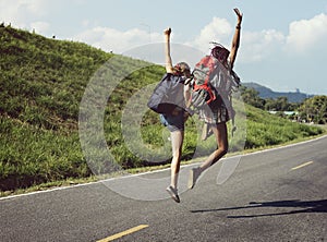 Women Backpacker Jumping on The Street