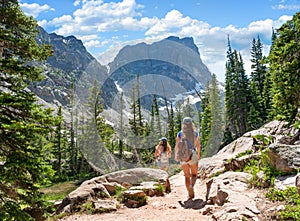 Women with backpacks hiking in Colorado mountains