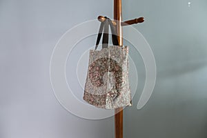 Women bag hangs on the hanging pole rack