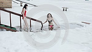 Women bathing in the ice hole.