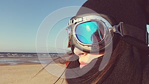 Women at beach with moto glasses