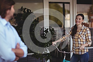 Women on bicycle outside the cafeÃÂ 