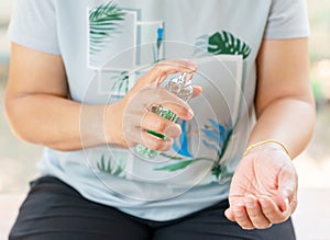 Women bride applying perfume on her wrist