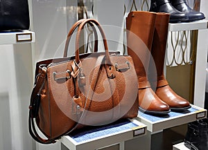 Women brown boots and leather bag