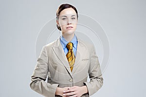 Women in Business Concepts. Young Caucasian Business Woman Natural Portrait. Posing Against Gray