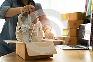 Women business owner work at home selling shoes