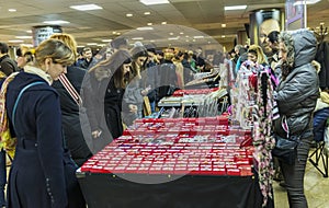 Women buying martisoare to celebrate beginning of spring on Mar