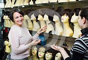 Women buying modern periwigs