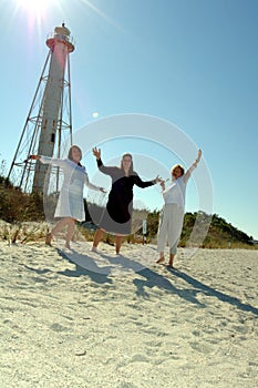 Women celebrate beach vacation