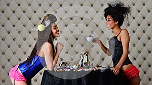 women chat over tea