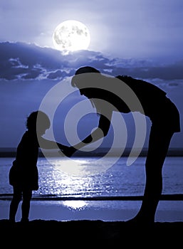 Women and child on moon night