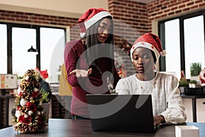 Women in christmas decorated office
