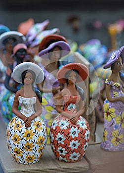 Women of clay dolls. Beautiful clay women. Concept of women of clay.