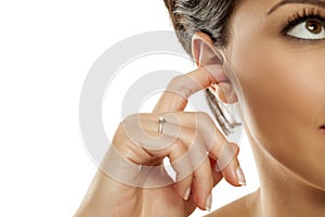 Women cleaning her ear