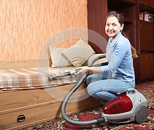 Women cleaning her living room.