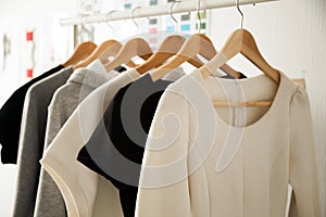Women clothes hanging on hangers clothing rails, fashion design