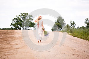 Women on country road with flowers