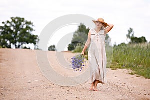 Women on country road with flowers